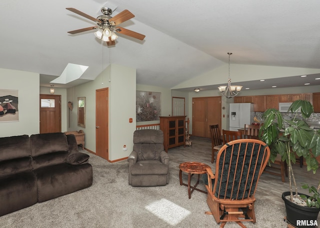 2035 N Gayman Ave, Davenport, IA 52804 - living room featuring vaulted ceiling, ceiling fan, a skylight, a chandelier, and carpet floors