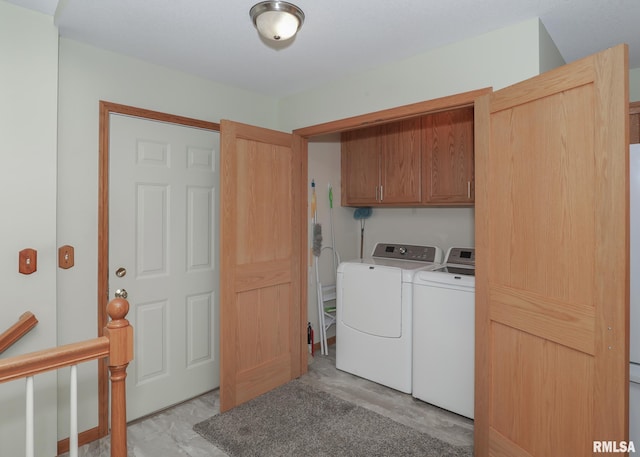 2035 N Gayman Ave, Davenport, IA 52804 - laundry area with washer and clothes dryer and cabinet space
