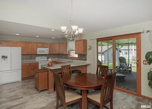 2035 N Gayman Ave, Davenport, IA 52804 - dining space with a chandelier, recessed lighting, and light wood finished floors