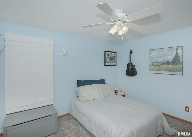 2035 N Gayman Ave, Davenport, IA 52804 - carpeted bedroom featuring baseboards and a ceiling fan