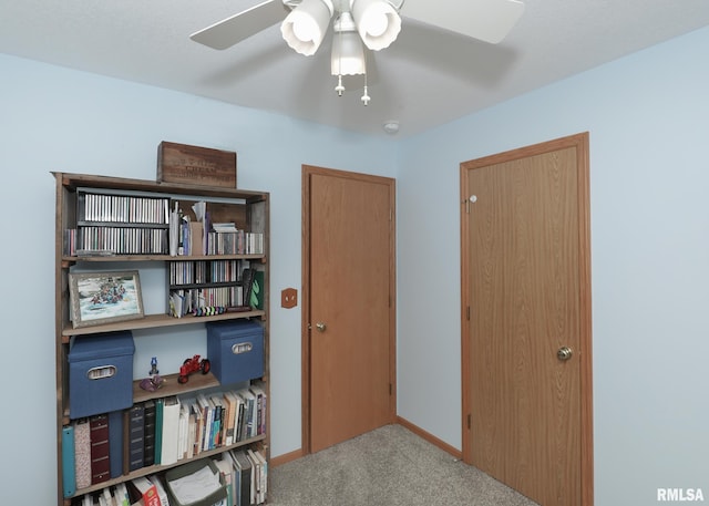 2035 N Gayman Ave, Davenport, IA 52804 - carpeted bedroom with baseboards and ceiling fan