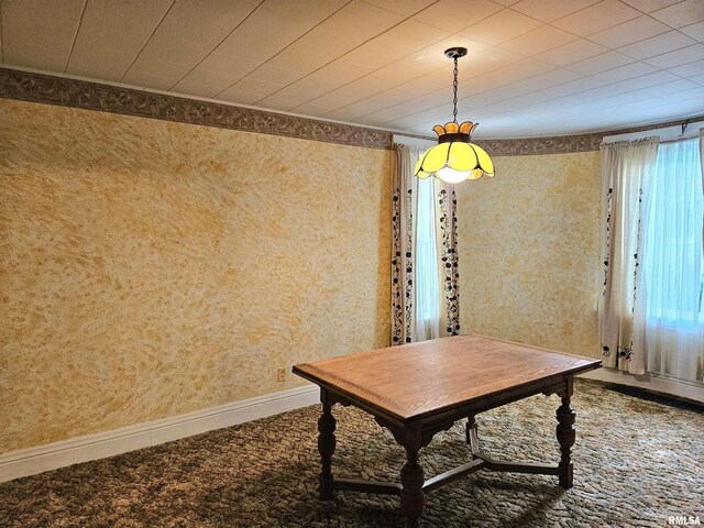 320 W 4th St, Wilton, IA 52778 - dining area with carpet floors and wallpapered walls