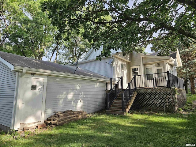 320 W 4th St, Wilton, IA 52778 - back of property with stairs, a deck, and a yard