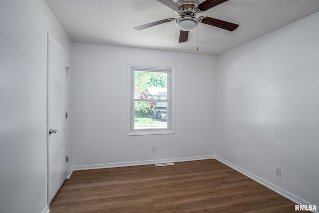 1811 Valley Dr, Davenport, IA 52806 - spare room featuring dark wood-style floors and ceiling fan
