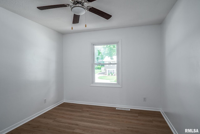 1811 Valley Dr, Davenport, IA 52806 - unfurnished room featuring dark wood finished floors and a ceiling fan