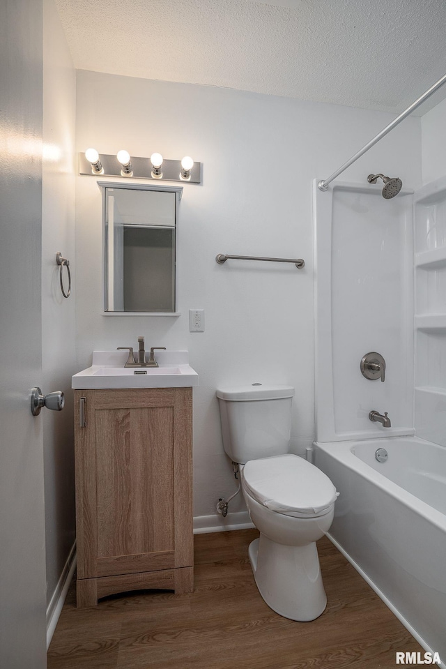 1811 Valley Dr, Davenport, IA 52806 - full bath featuring wood finished floors, vanity,  shower combination, and a textured ceiling