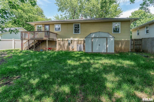 1811 Valley Dr, Davenport, IA 52806 - rear view of property featuring stairway, a storage shed, a fenced backyard, a deck, and brick siding