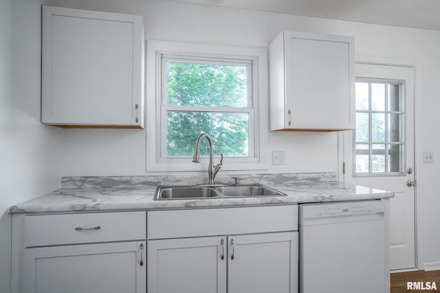 1811 Valley Dr, Davenport, IA 52806 - kitchen with dishwasher and white cabinetry