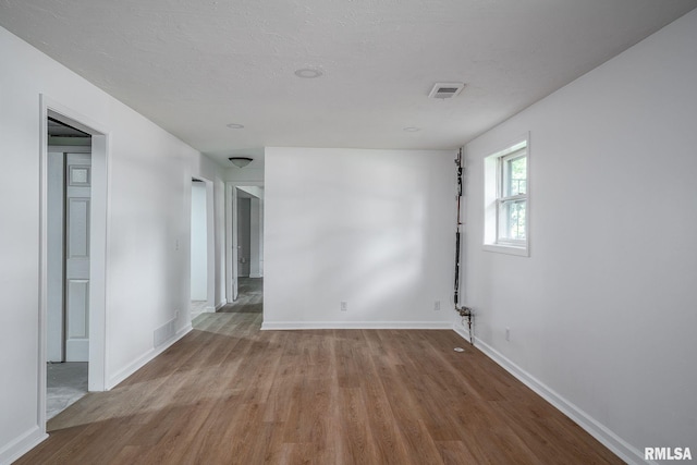 1811 Valley Dr, Davenport, IA 52806 - empty room with wood finished floors