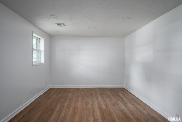 1811 Valley Dr, Davenport, IA 52806 - empty room with wood finished floors and baseboards