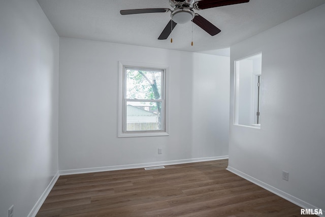1811 Valley Dr, Davenport, IA 52806 - unfurnished room with dark wood-style flooring and ceiling fan
