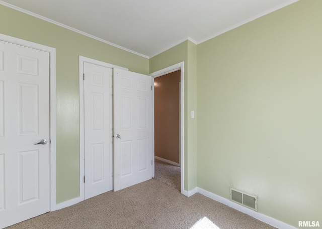 1035 14th Ave S, Clinton, IA 52732 - unfurnished bedroom with carpet and crown molding