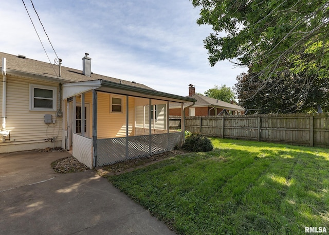 1035 14th Ave S, Clinton, IA 52732 - fenced backyard with a patio area