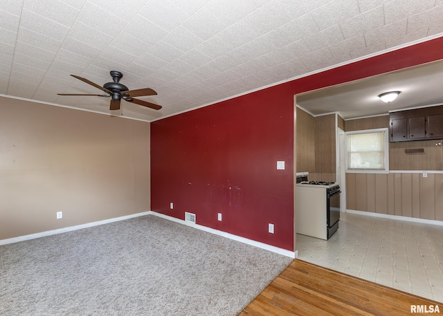 1035 14th Ave S, Clinton, IA 52732 - empty room with ceiling fan, crown molding, and light wood-style floors