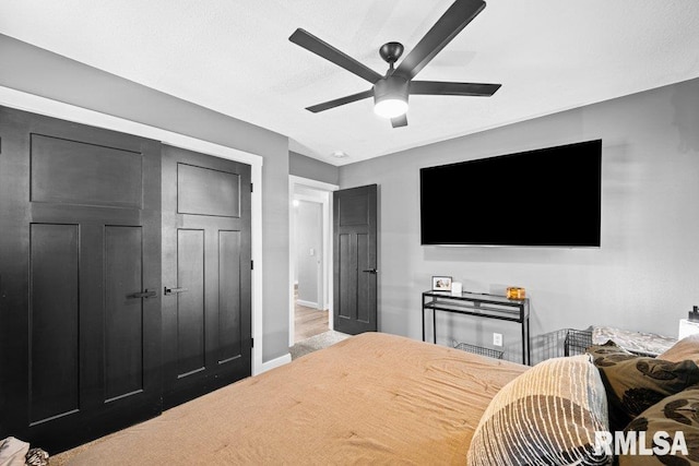 3307 Clover Hills Dr, Bettendorf, IA 52722 - bedroom featuring baseboards and a ceiling fan