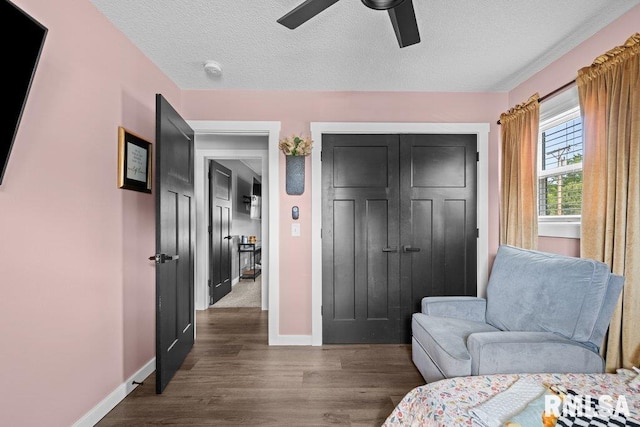 3307 Clover Hills Dr, Bettendorf, IA 52722 - sitting room featuring ceiling fan, dark wood-style floors, and a textured ceiling