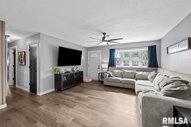 3307 Clover Hills Dr, Bettendorf, IA 52722 - living room with wood finished floors, ceiling fan, and a textured ceiling