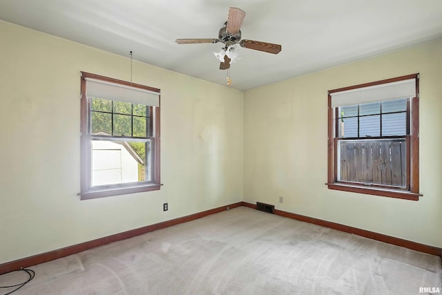 2348 24 1/2 St, Rock Island, IL 61201 - spare room featuring light colored carpet and ceiling fan