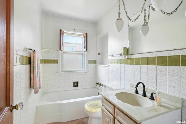2348 24 1/2 St, Rock Island, IL 61201 - bathroom with tile walls, a bathtub, vanity, and wainscoting