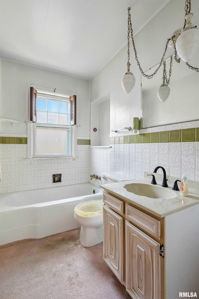 2348 24 1/2 St, Rock Island, IL 61201 - bathroom with vanity, a garden tub, tile walls, and wainscoting