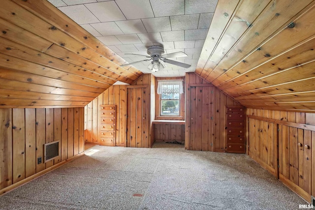 2348 24 1/2 St, Rock Island, IL 61201 - bonus room with wood walls, lofted ceiling, carpet floors, and a ceiling fan