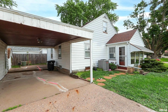 2348 24 1/2 St, Rock Island, IL 61201 - view of front of home featuring a carport and roof with shingles