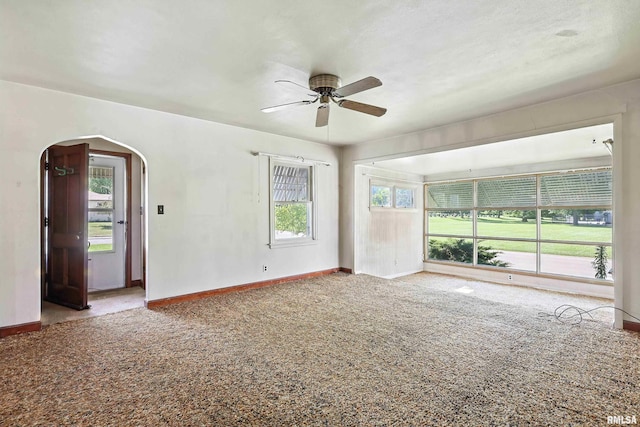 2348 24 1/2 St, Rock Island, IL 61201 - carpeted spare room featuring ceiling fan and arched walkways