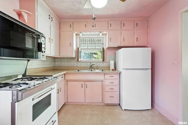 2348 24 1/2 St, Rock Island, IL 61201 - kitchen with white appliances, light countertops, decorative backsplash, a ceiling fan, and a textured ceiling