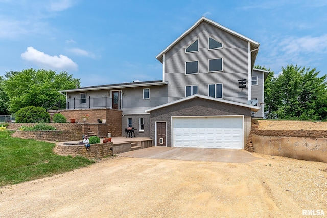 4460 160th St, Clinton, IA 52732 - view of front of property with a garage and brick siding
