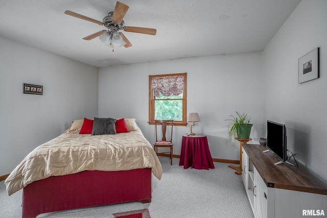 4460 160th St, Clinton, IA 52732 - carpeted bedroom with baseboards and ceiling fan
