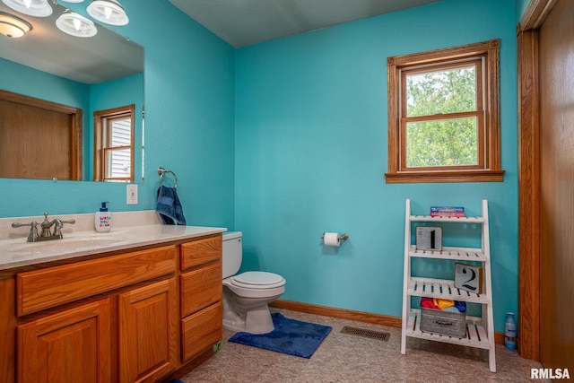 4460 160th St, Clinton, IA 52732 - bathroom featuring vanity and toilet