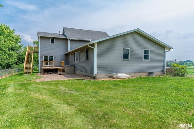 4460 160th St, Clinton, IA 52732 - rear view of house featuring stairway, a fenced backyard, and a wooden deck