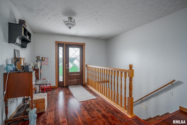4460 160th St, Clinton, IA 52732 - entryway featuring wood-type flooring and a textured ceiling