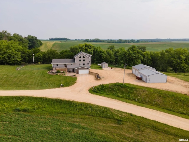4460 160th St, Clinton, IA 52732 - view of property's community featuring driveway, a view of rural / pastoral area, a garage, and a lawn