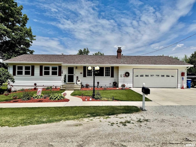 101 E 6th St, Sherrard, IL 61281 - ranch-style home featuring an attached garage, concrete driveway, a front yard, and a chimney