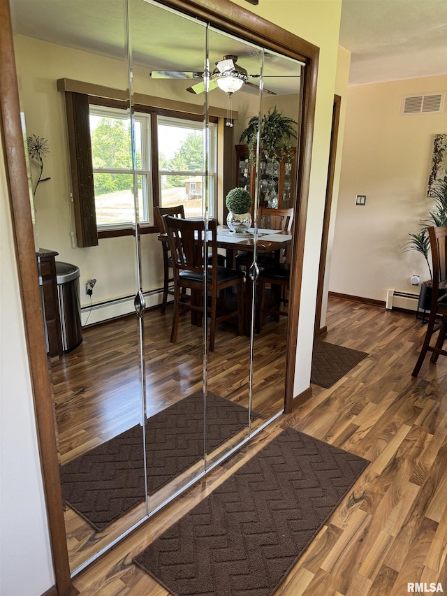 101 E 6th St, Sherrard, IL 61281 - dining room featuring baseboard heating, wood finished floors, and ceiling fan
