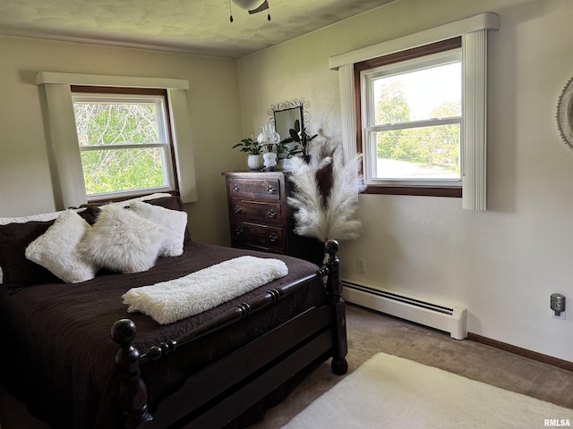 101 E 6th St, Sherrard, IL 61281 - carpeted bedroom featuring baseboard heating and baseboards