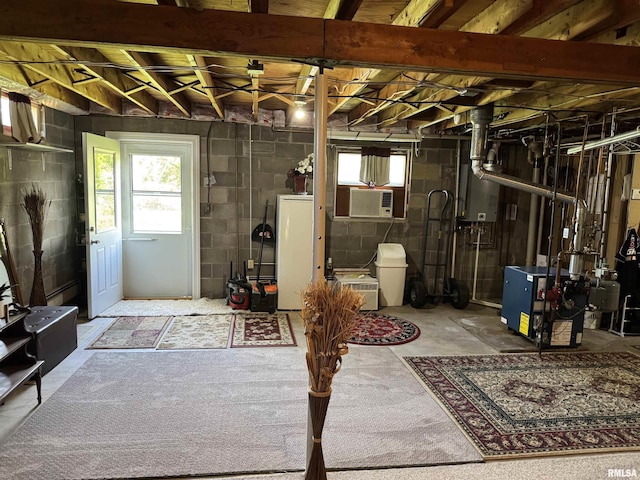 101 E 6th St, Sherrard, IL 61281 - below grade area featuring a heating unit, refrigerator, and cooling unit
