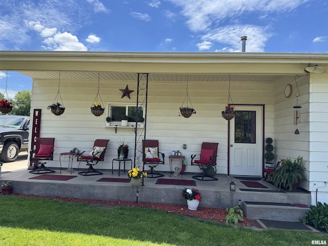 101 E 6th St, Sherrard, IL 61281 - doorway to property featuring covered porch