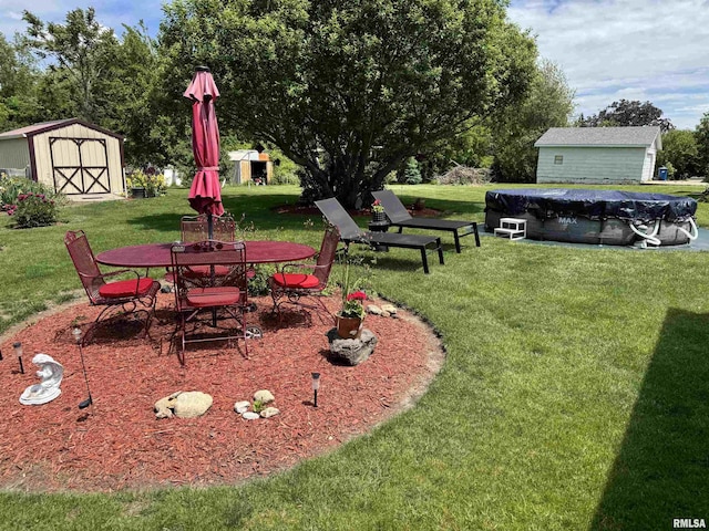 101 E 6th St, Sherrard, IL 61281 - view of green lawn with a shed, a covered pool, and outdoor dining space