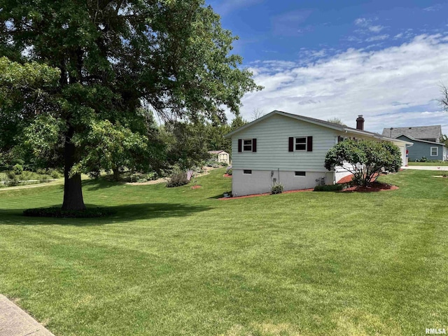 101 E 6th St, Sherrard, IL 61281 - view of property exterior featuring a yard and a chimney