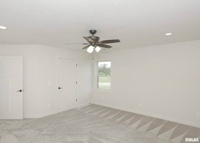 624 Rock Point Rd, Colona, IL 61241 - empty room featuring recessed lighting, light carpet, a ceiling fan, and a textured ceiling