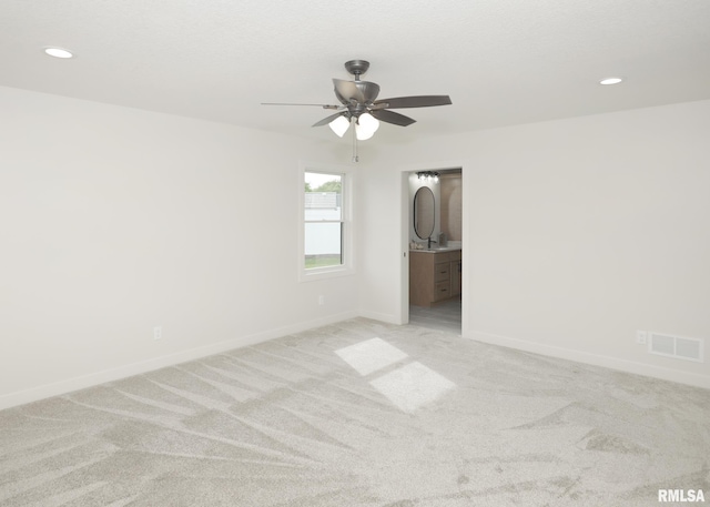 624 Rock Point Rd, Colona, IL 61241 - unfurnished room with a ceiling fan, light colored carpet, and recessed lighting