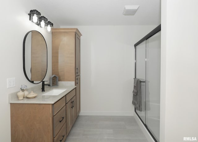 624 Rock Point Rd, Colona, IL 61241 - full bathroom featuring vanity and a shower with shower door