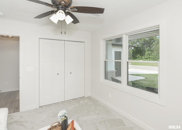 624 Rock Point Rd, Colona, IL 61241 - unfurnished bedroom featuring a closet and ceiling fan