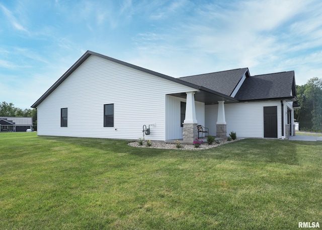 624 Rock Point Rd, Colona, IL 61241 - rear view of property with a lawn, roof with shingles, and covered porch
