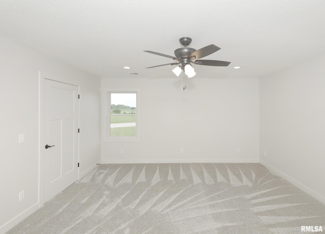624 Rock Point Rd, Colona, IL 61241 - spare room with light colored carpet, a ceiling fan, and recessed lighting