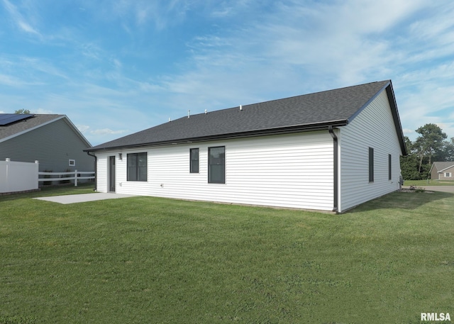 624 Rock Point Rd, Colona, IL 61241 - back of house featuring a patio and roof with shingles