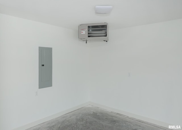624 Rock Point Rd, Colona, IL 61241 - empty room with electric panel, a heating unit, and concrete floors
