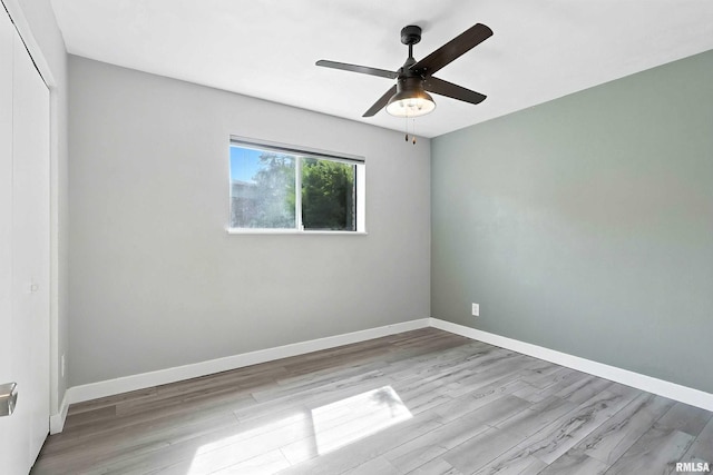 3045 4th St Unit 1, Moline, IL 61265 - spare room with wood finished floors and ceiling fan